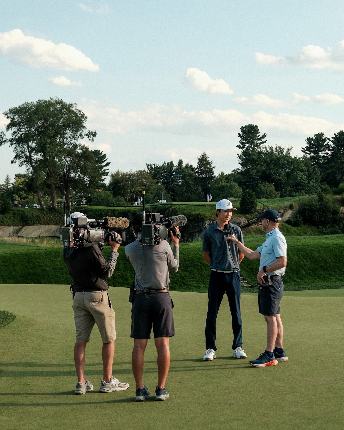 Jay Leng being interviewed on a golf green