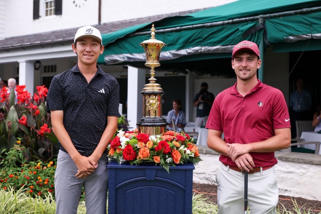 Jay Leng standing beside the U.S. Amateur trophy with the other finalist